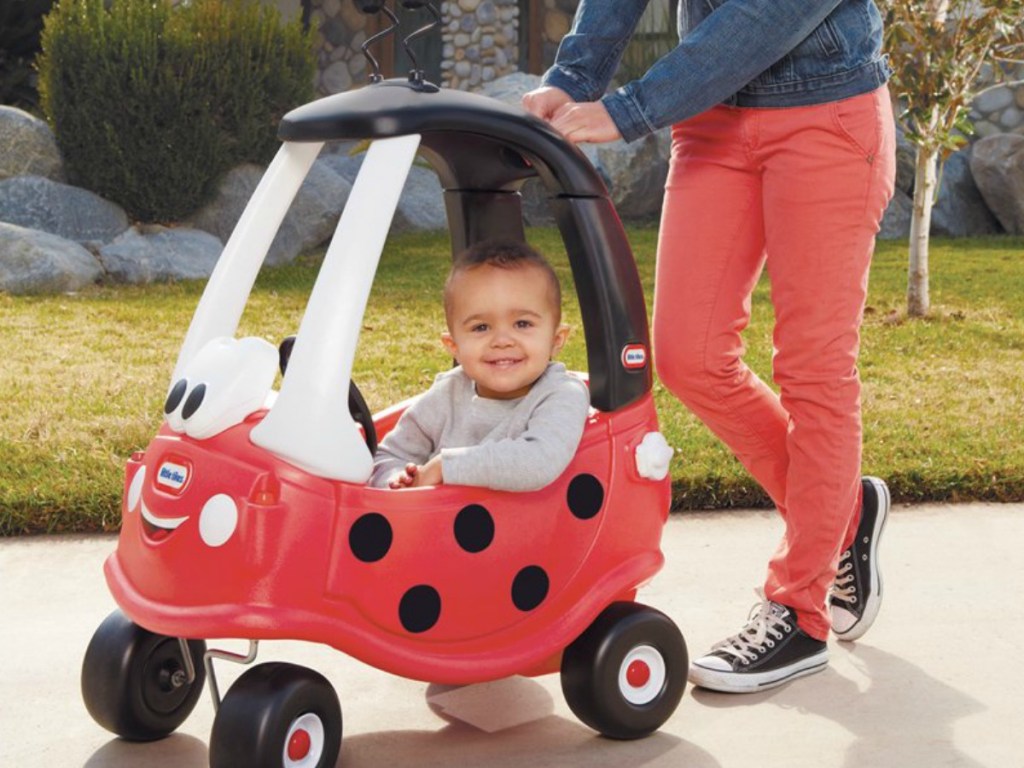 Little Tykes Ladybug Coupe being pushed by parent