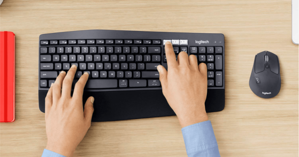 Logitech MK850 Performance Wireless Keyboard and Optical Mouse top view with person clicking on buttons