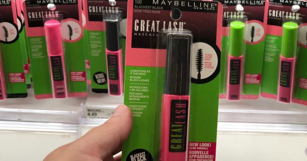 hand holding Maybelline mascara