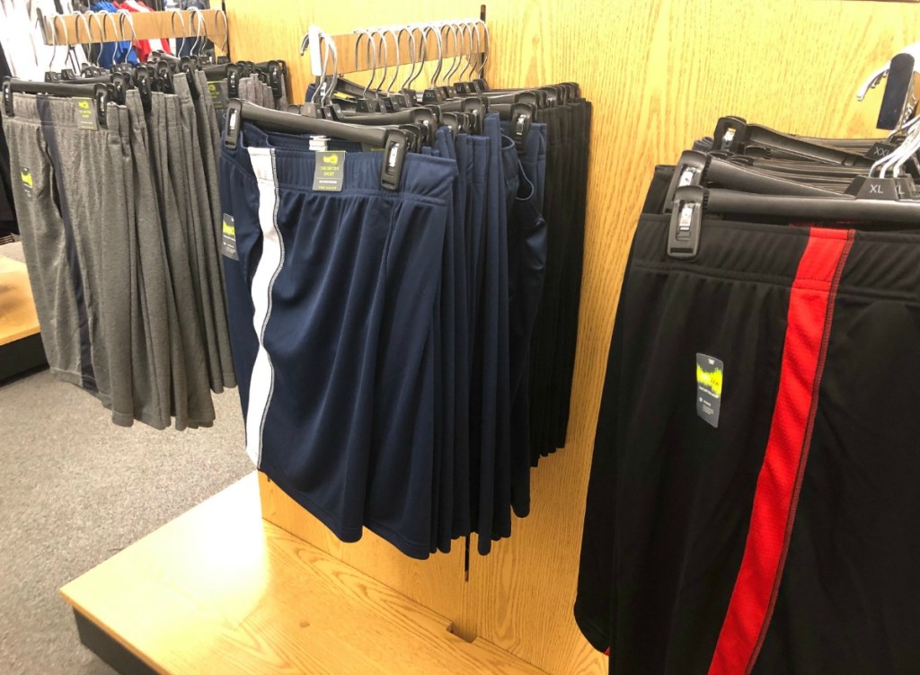 In-store display of men's active Tek Gear shorts in a variety of colors