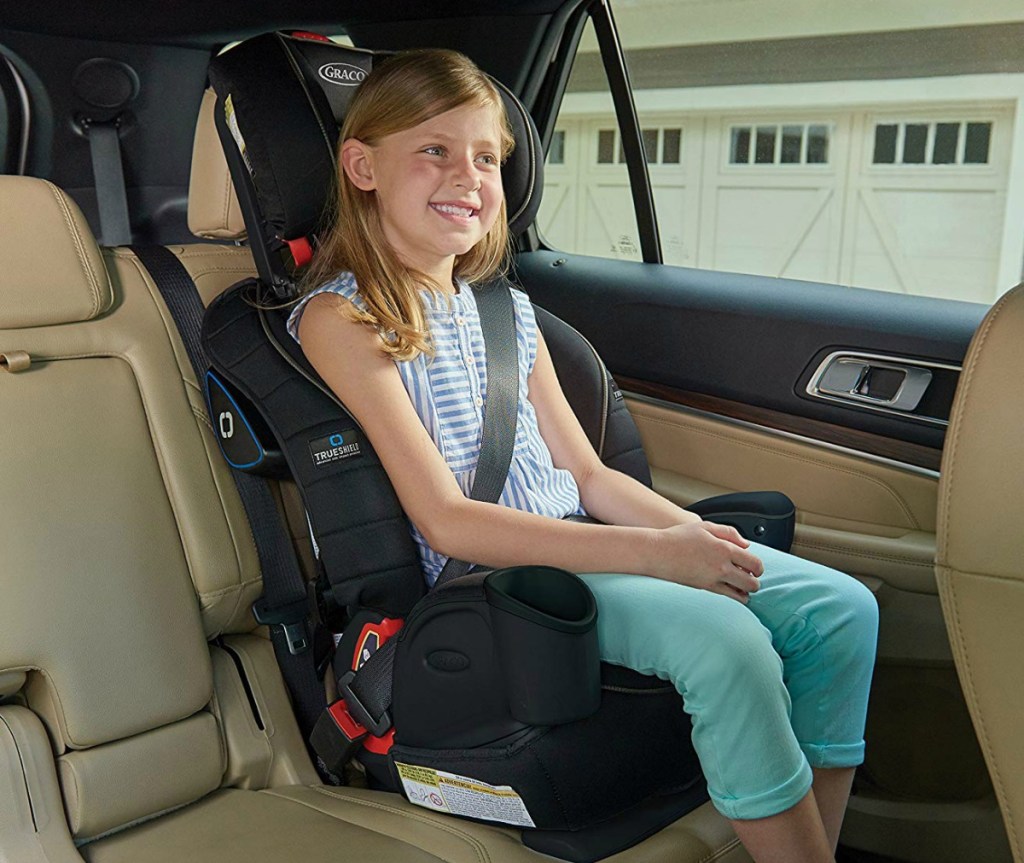 Three-in-One Harness Booster from Graco in car with child using seat-belt