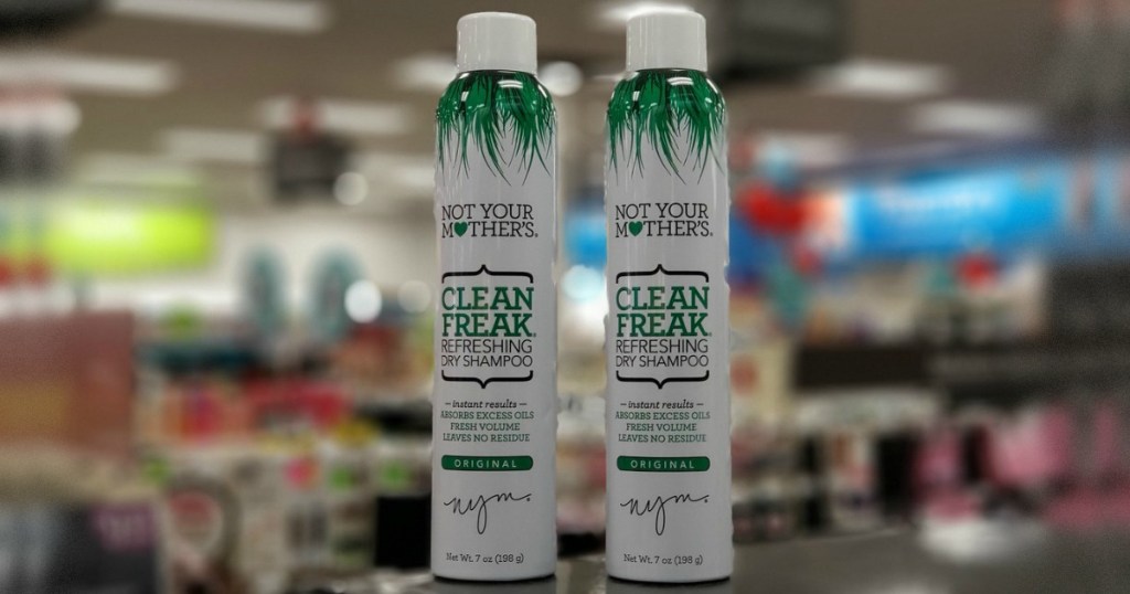 two bottles of dry shampoo in store on counter