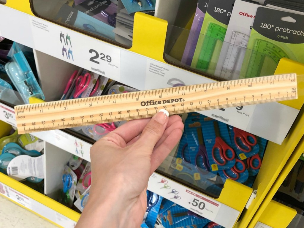 Office depot wooden ruler held in hand