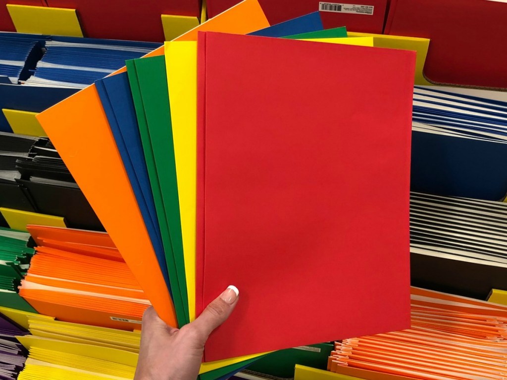 colorful paper folders fanned in front of bin