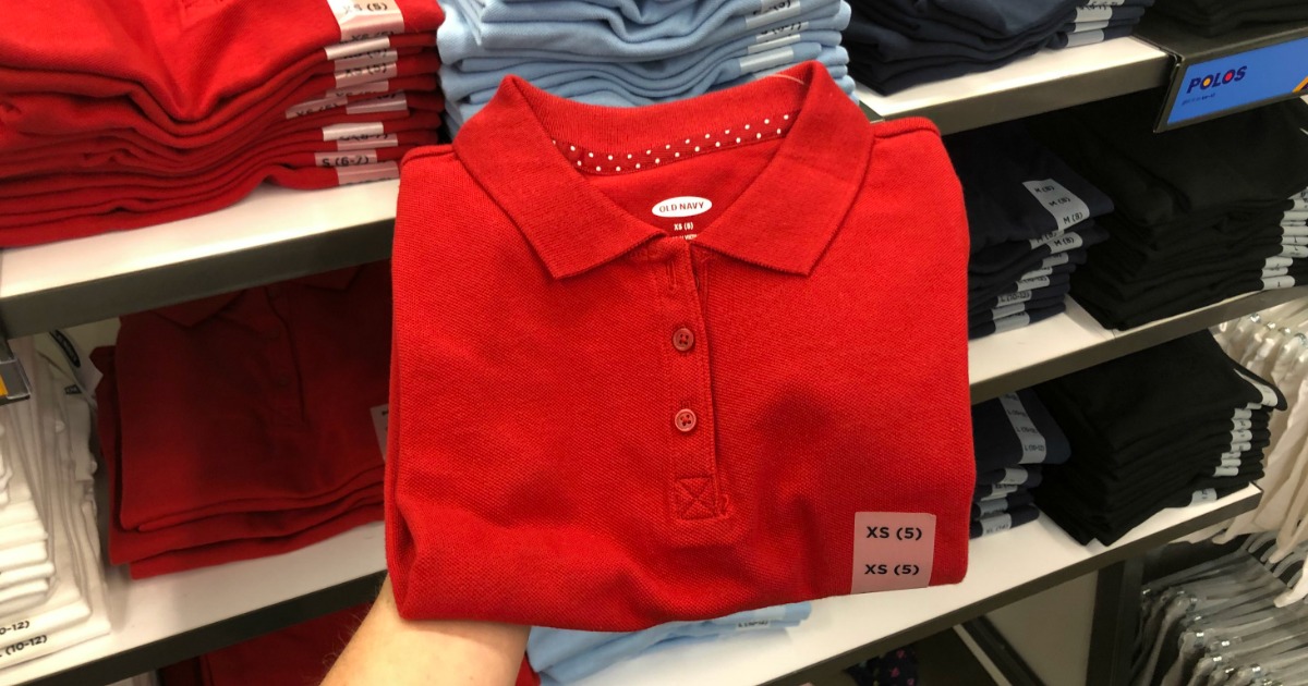 Hand holding up Old Navy Girls Red Polo Top