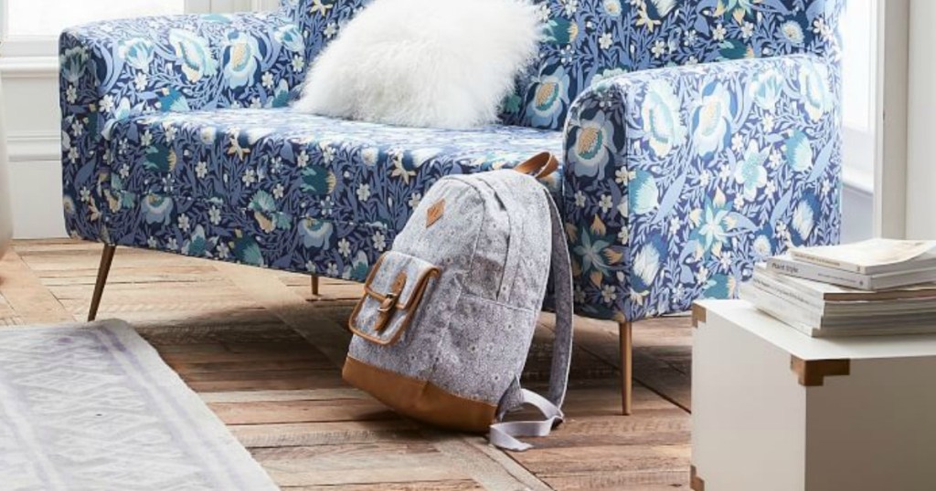 pottery barn backpack next to couch