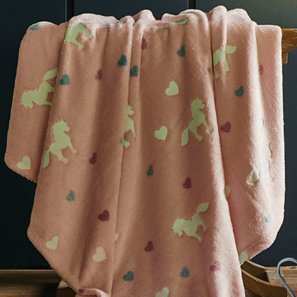 Pink plush throw blanket with unicorn print