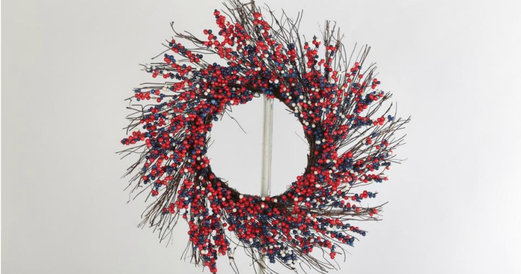 berry wreath hanging on hook