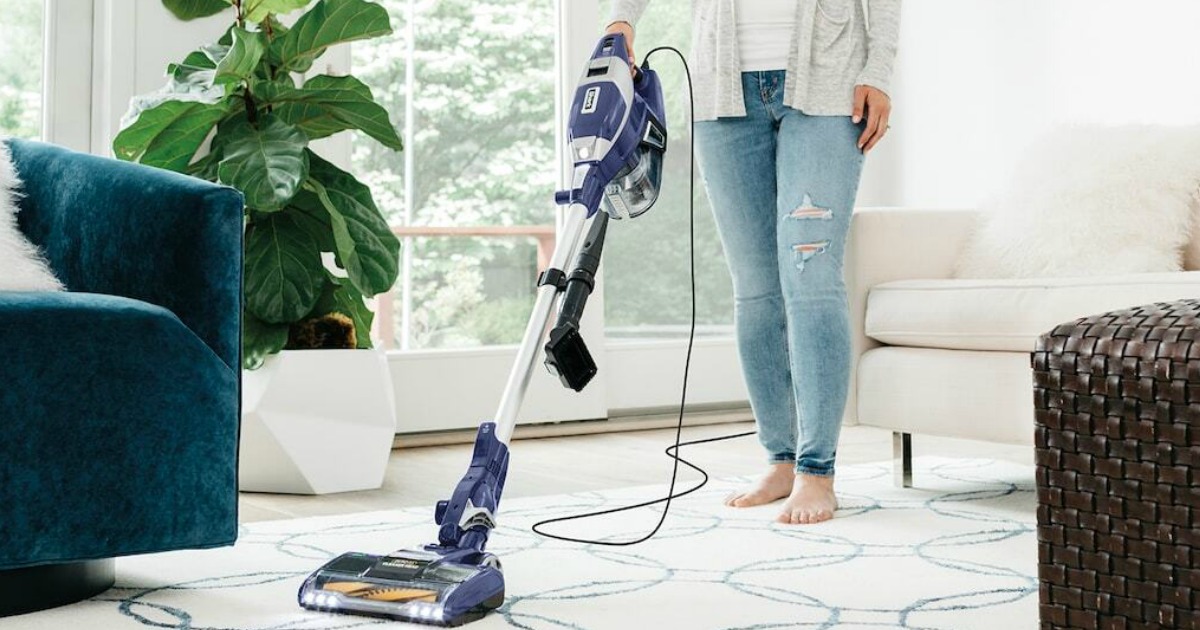 woman vacuuming with a Shark Rocket zero-m