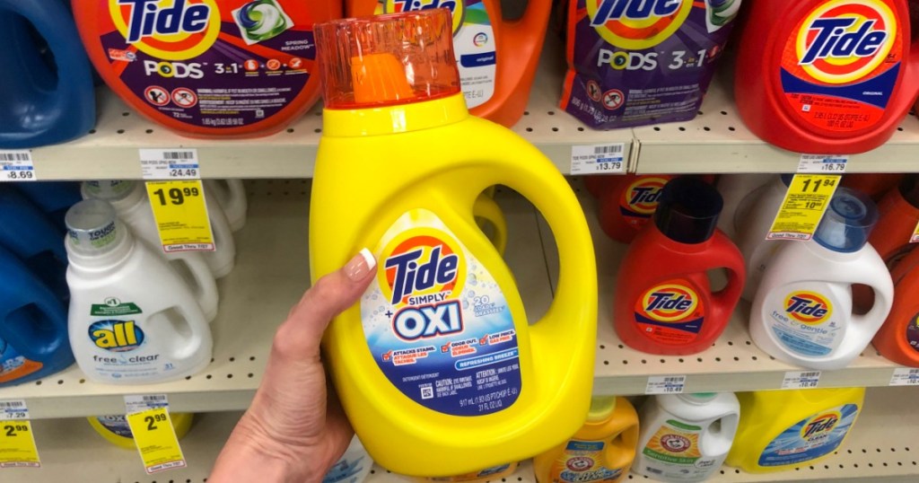 hand holding Tide Simply laundry detergent