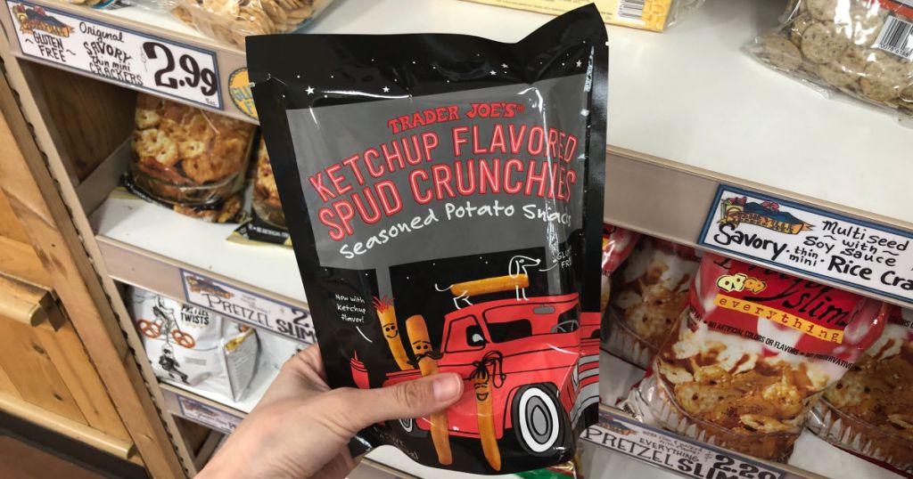 hand holding Trader Joes Ketchup Flavored Spud Crunchies in store