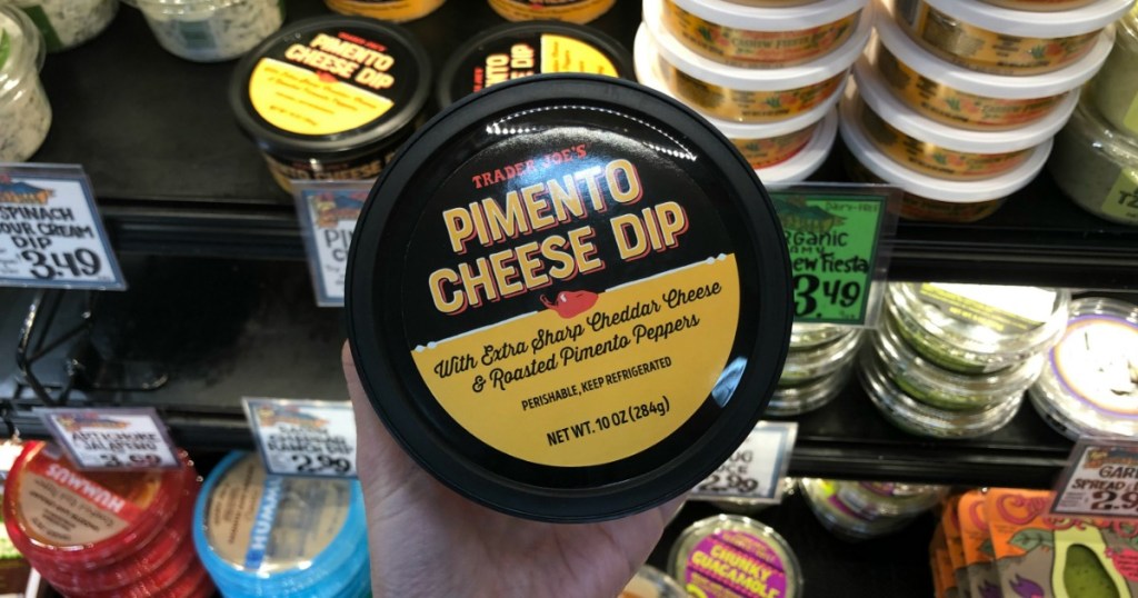 Woman holding Trader Joe's Pimento Cheese Dip