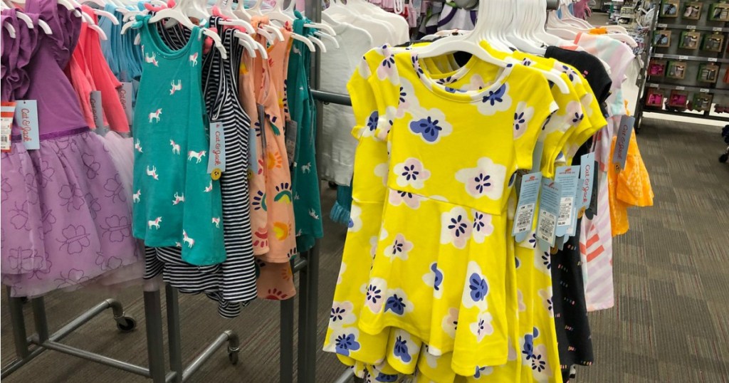 dresses on hangers in store display