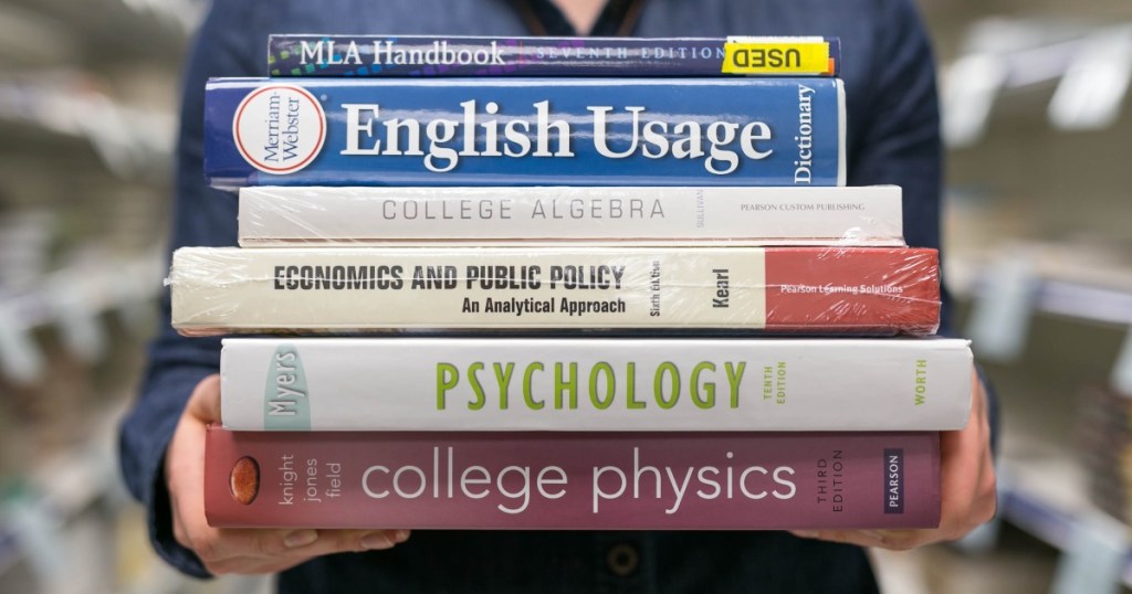 person holding books 