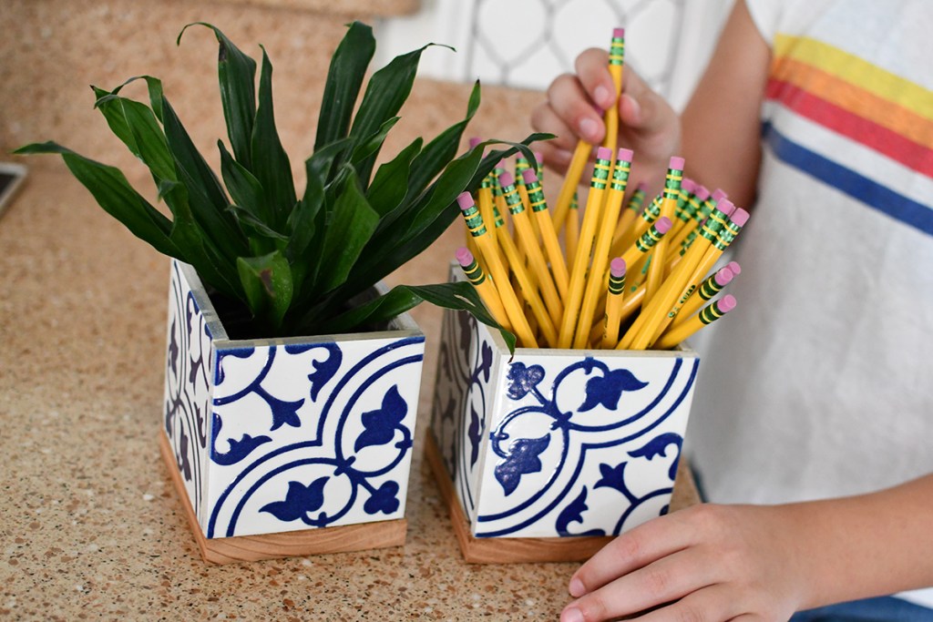 grabbing pencil out of diy pencil tile holder