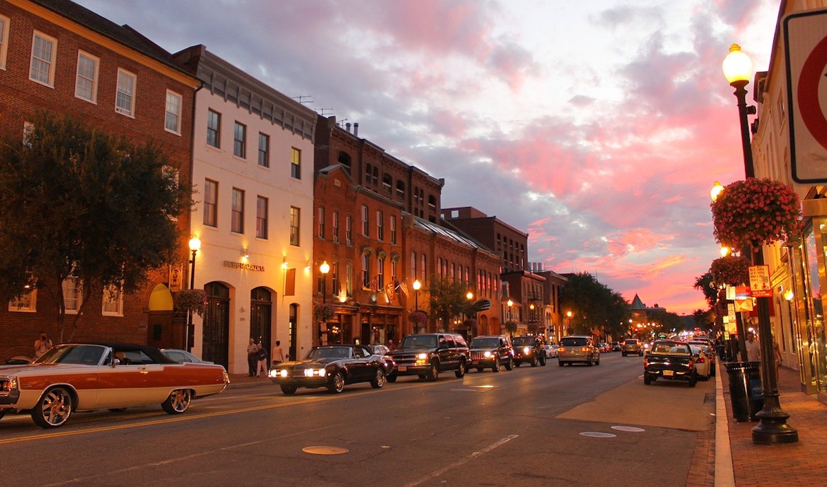 city street at night with cars and lights 