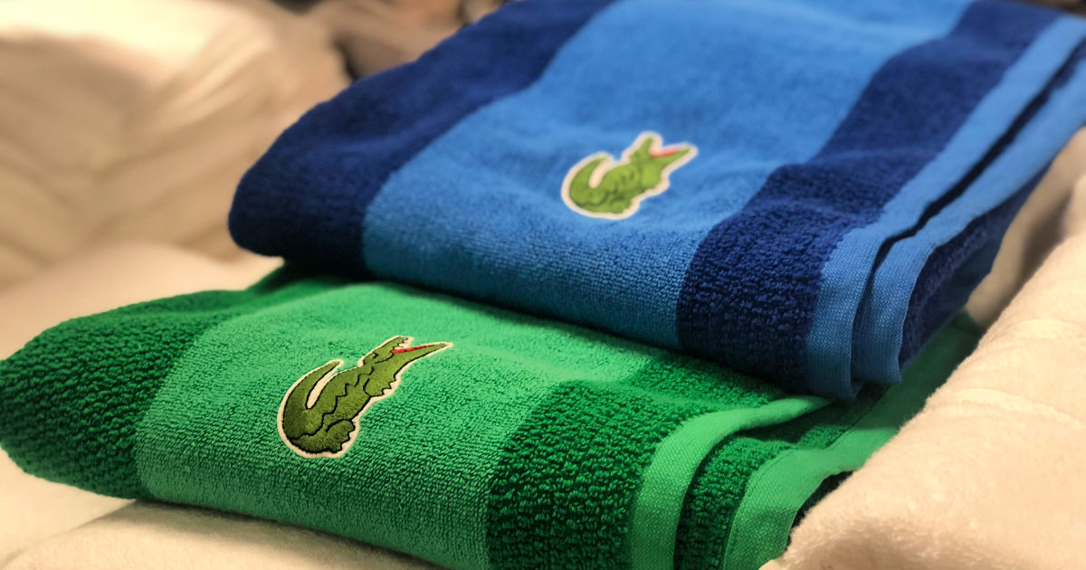 blue and green lacoste colorblocked towels in store