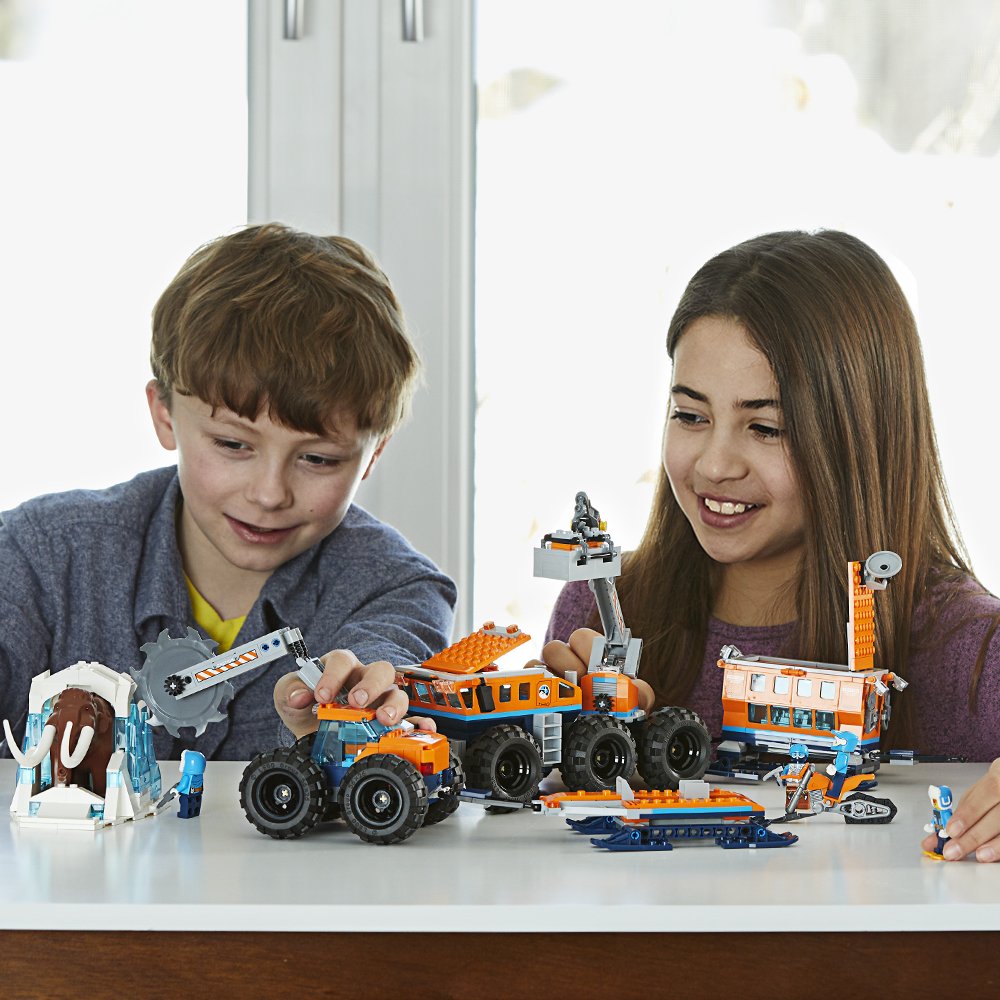 Boy and Girl playing with LEGO Arctic Base