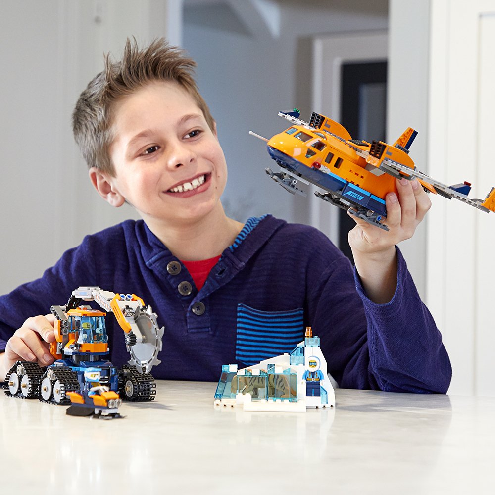 Boy playing with Lego Plane