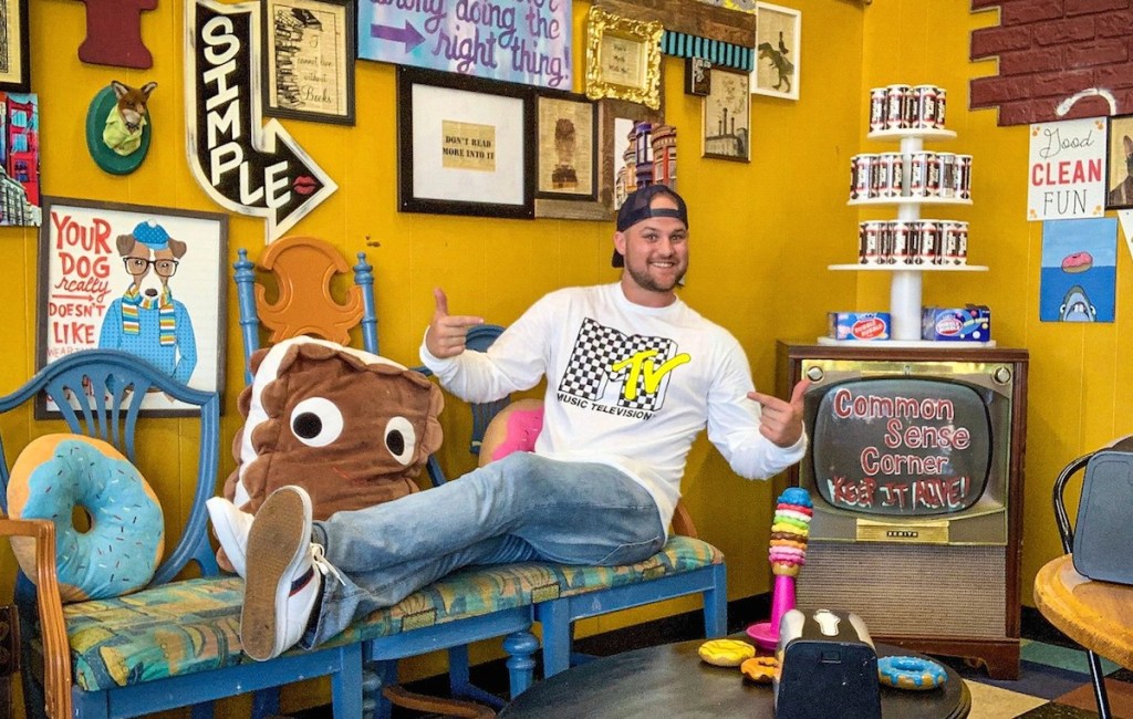 man in colorful novelty room with mtv shirt 