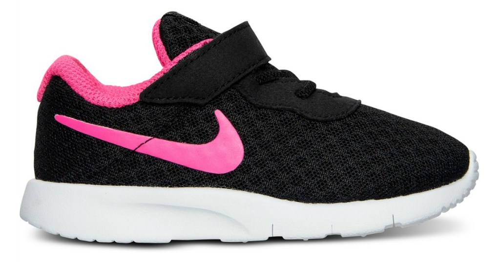 black Nike shoe with pink swoosh