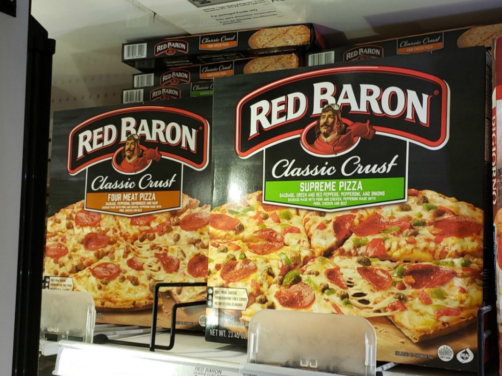 red baron classic crust supreme and four meat pizzas in refrigerator at store