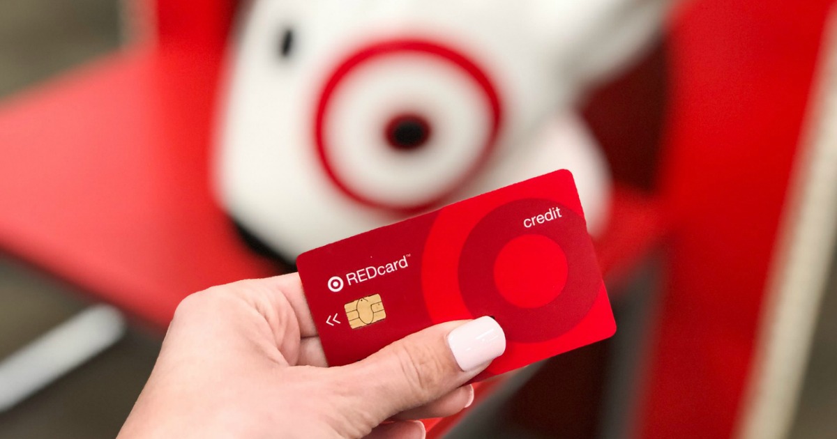 Hand holding a Target REDcard in Target store in front of display