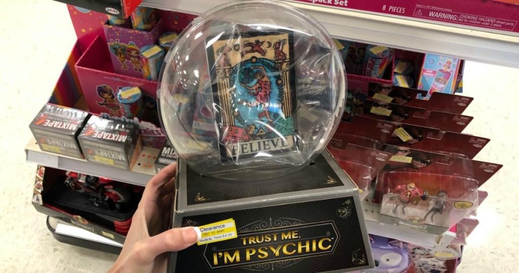 hand holding game that looks like crystal ball in store