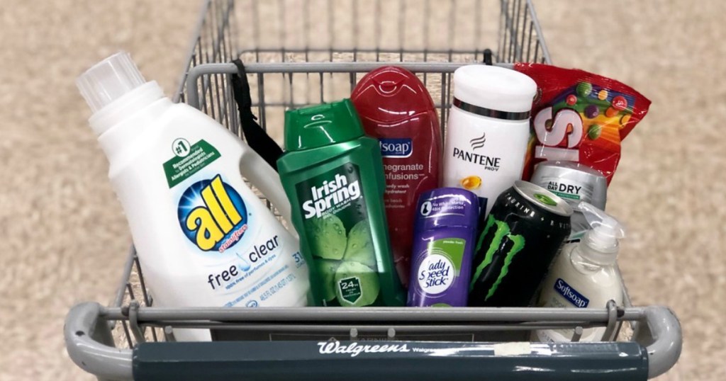 all laundry detergent, irish spring and soft soap body wash, pantene shampoo, speed stick deodorant, monster energy drink and skittles candy in a shopping cart at walgreens