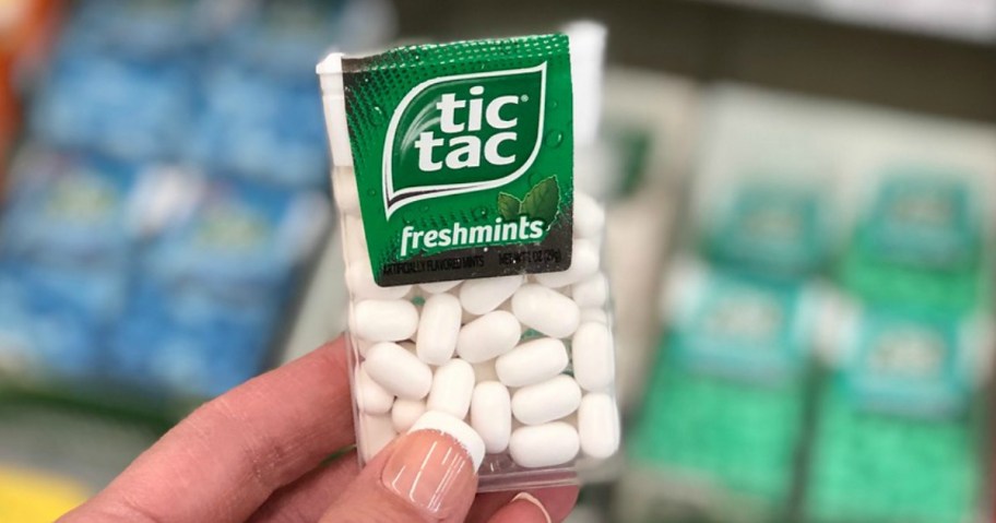 hand holding tic tac mints at walgreens