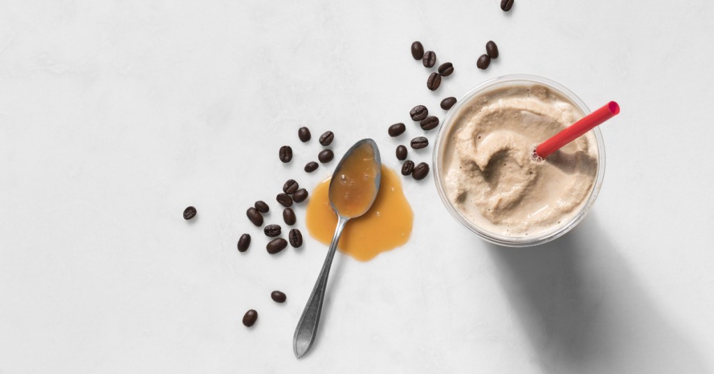 spoon with caramel, coffee beans and Chick-fil-A frosted coffee