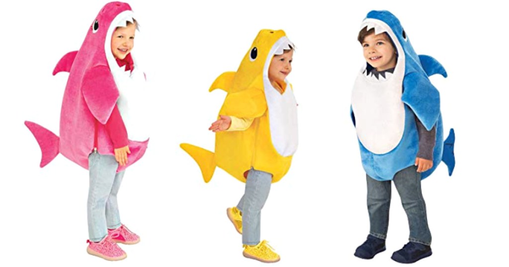 3 kids wearing baby shark costumes