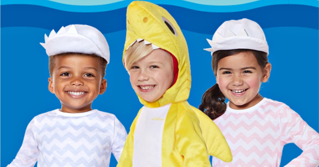 3 kids wearing baby shark costumes