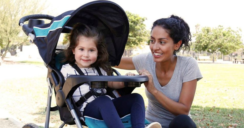 kid riding in stroller