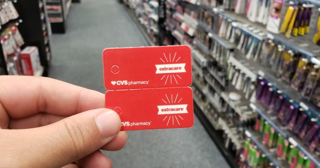 man holding CVS ExtraCare Cards