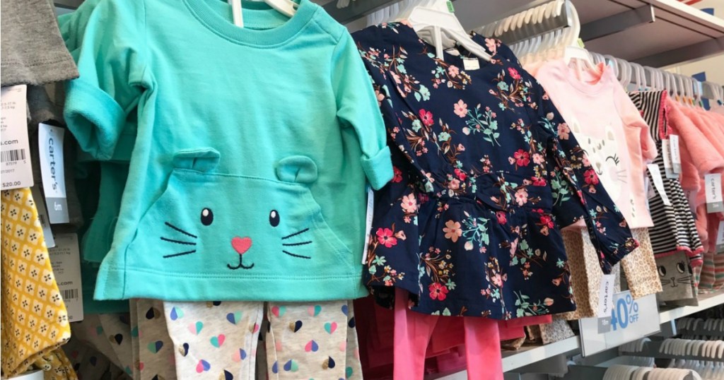 Carter's 2-Piece Sets hanging on Kohl's rack