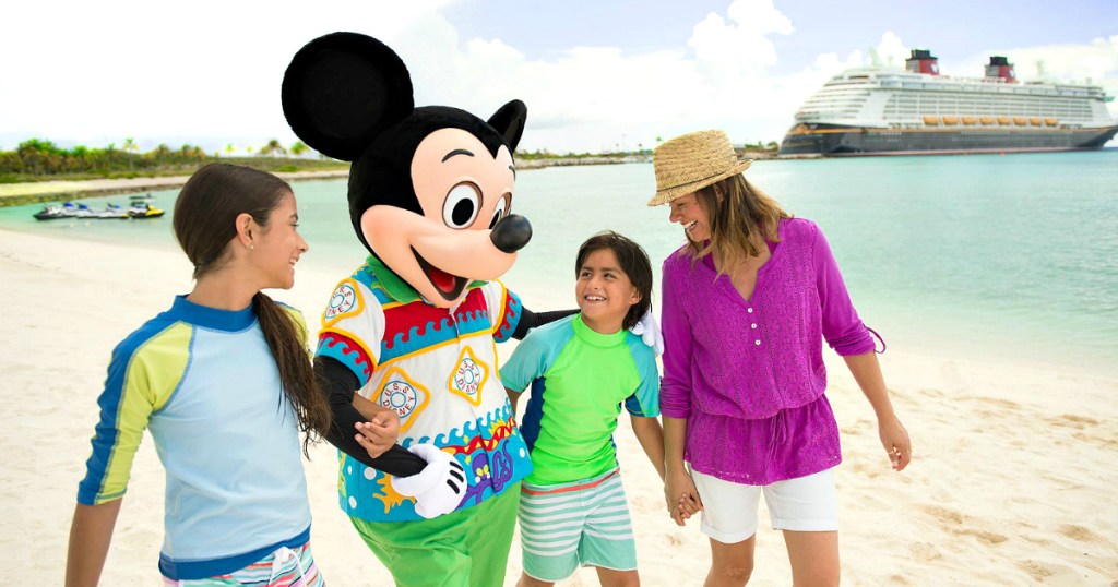 Mickey walking with family on beach