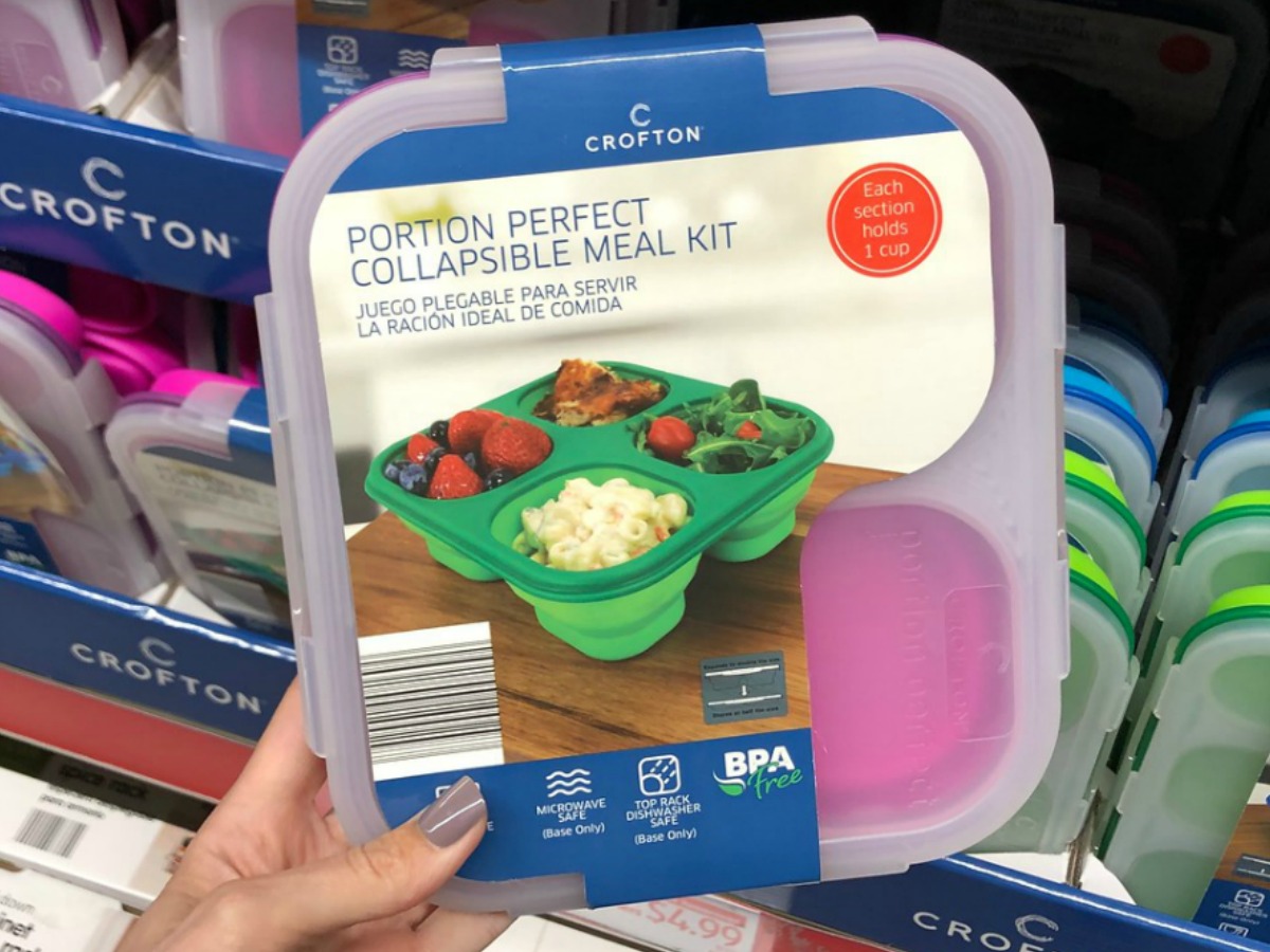 hand holding plastic lunch kit by store display