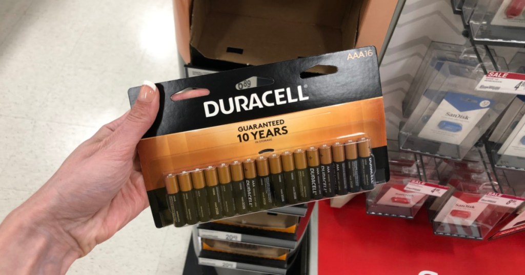 hand holding duracell batteries