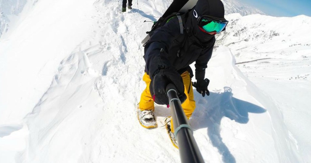 person holding selfie stick