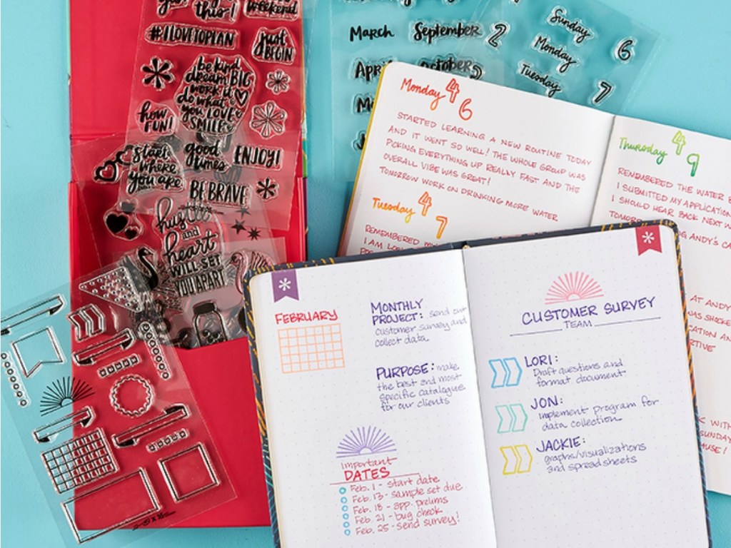 Erin Condren Stamp Sheets next to planner