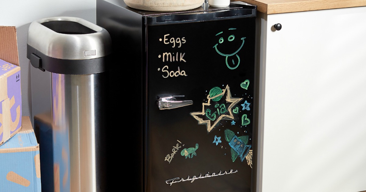 black mini fridge with dry erase door