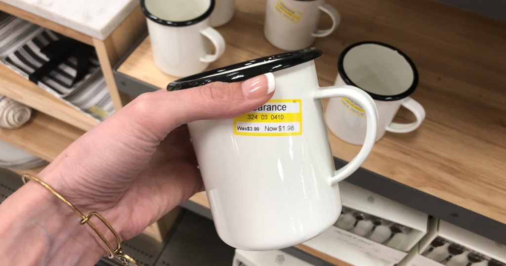 woman holding hearth and hand mug at target