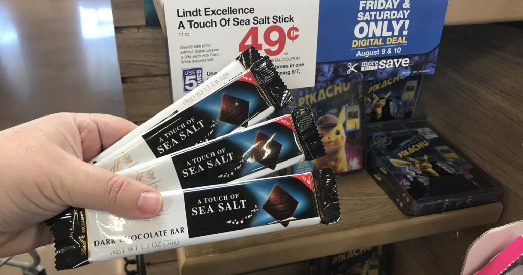 woman holding 3 lindt sea salt bars at kroger