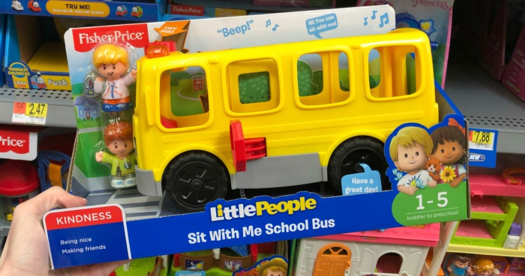 hand holding Little People bus