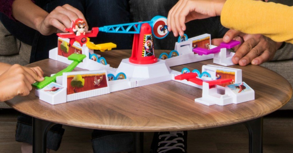 family playing Loopin' Louie board game