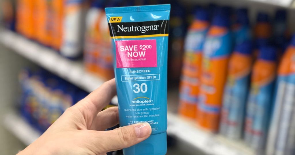 hand holding Neutrogena Sunscreen spf 30