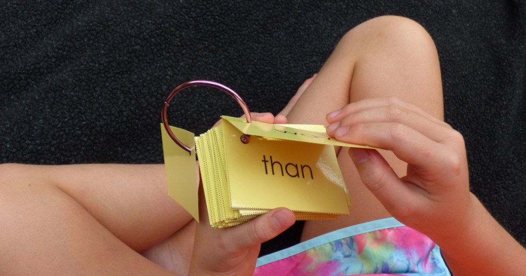 child holding word ring