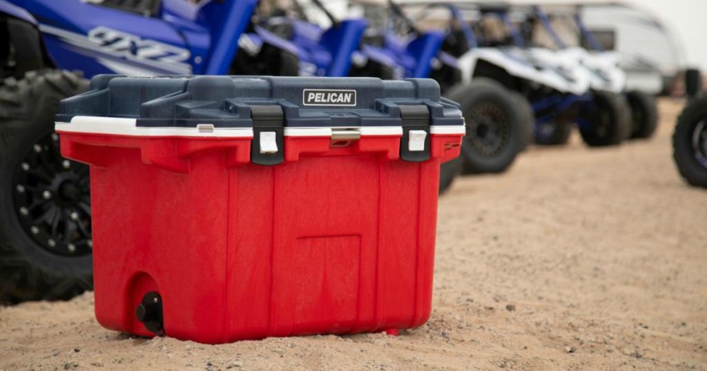 Pelican cooler on beach in front of ATVs