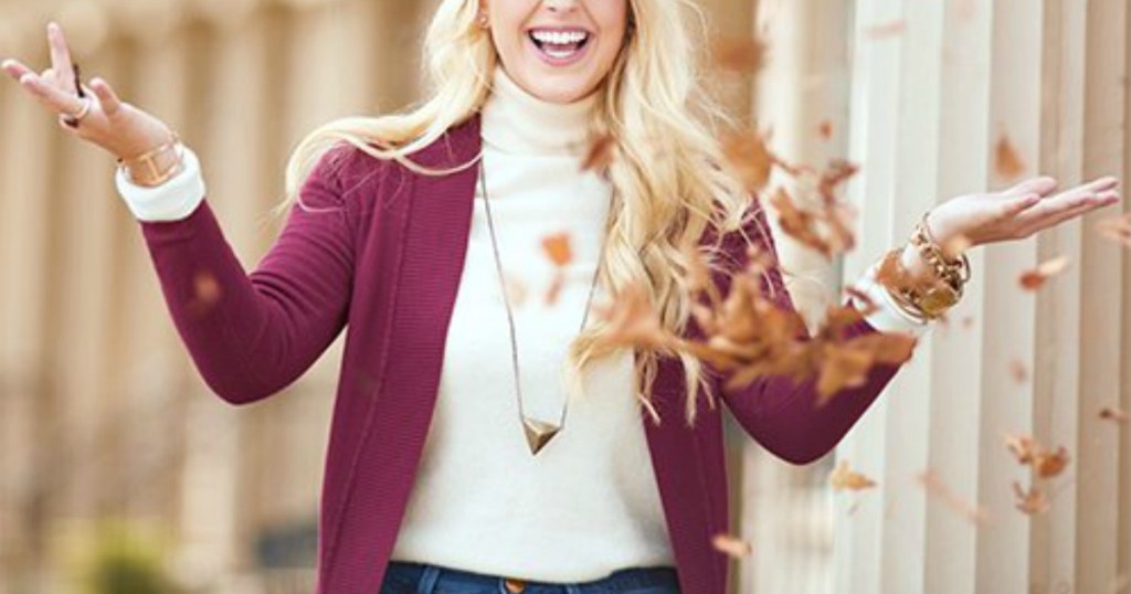 Pocket-front open cardigan on woman catching leaves